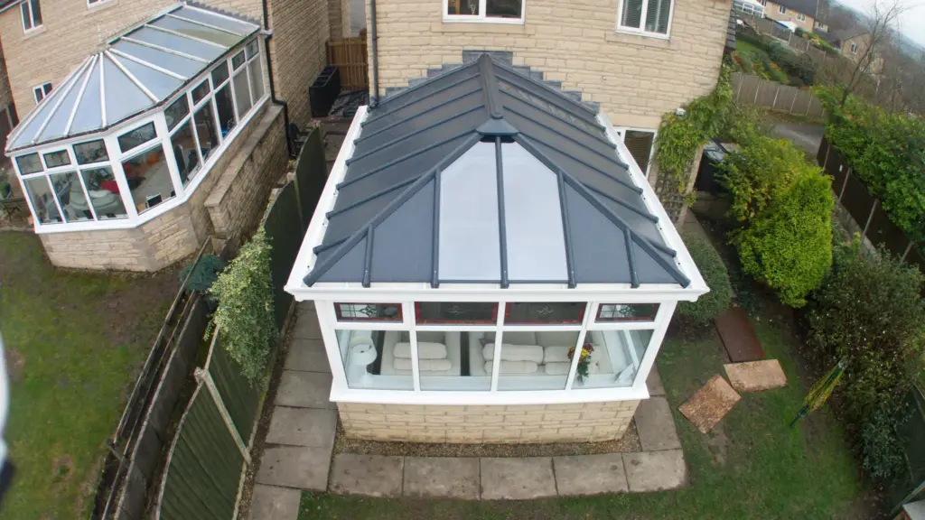conservatory on brick base with black roof