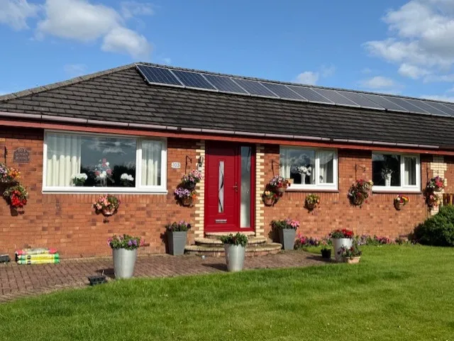white upvc casement and red door bungalow