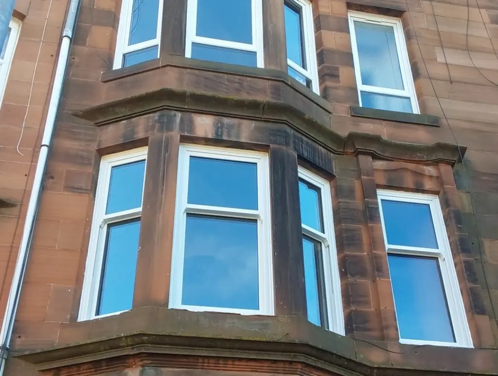 white upvc sash and case windows on town house