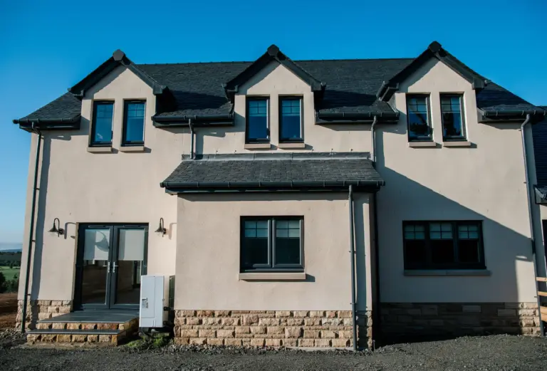 cream colour house with anthracite casment windows