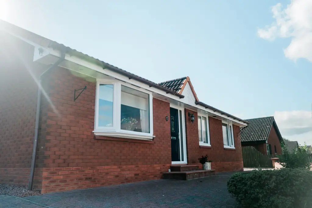 red brick house bow window replacement