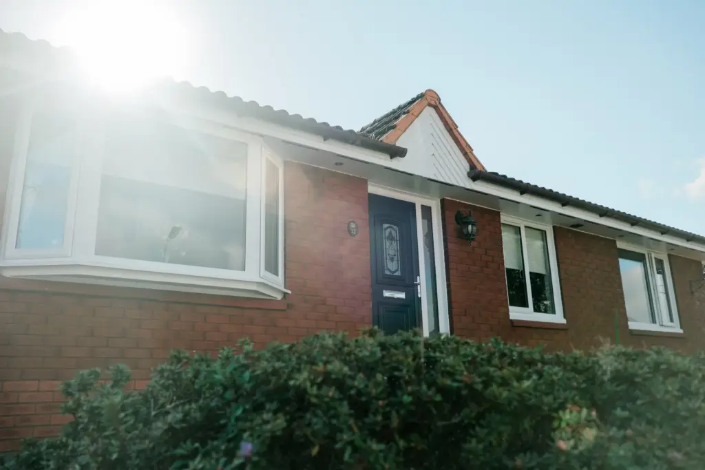 red brick house white windows