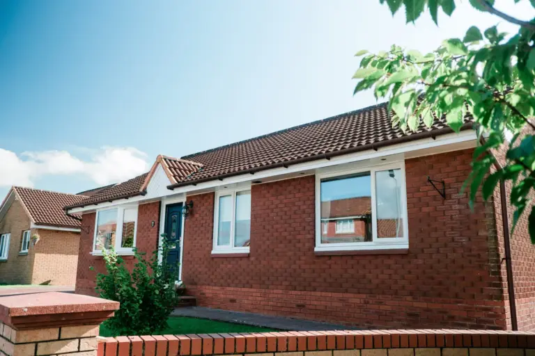 red brick house with door and window replacement