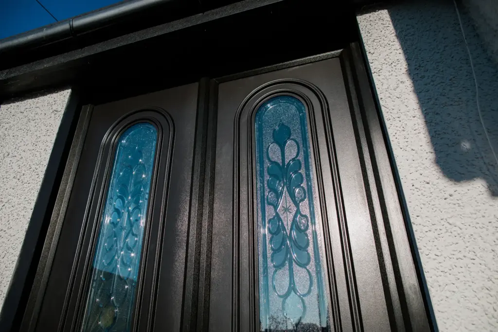 traditional brown upvc french doors with glass panel