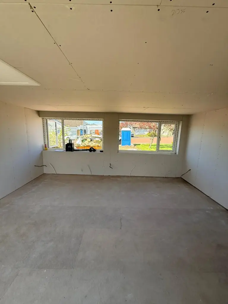 garage conversion with plasterboards before heaters are installed