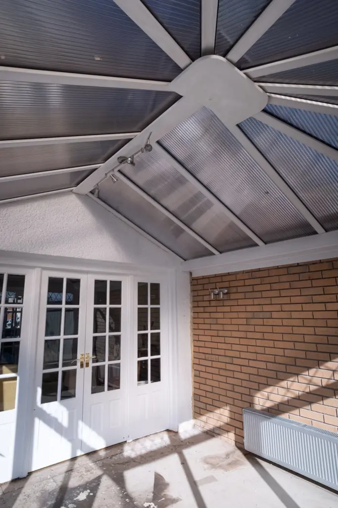 Interior view of the conservatory's polycarbonate roof before replacement